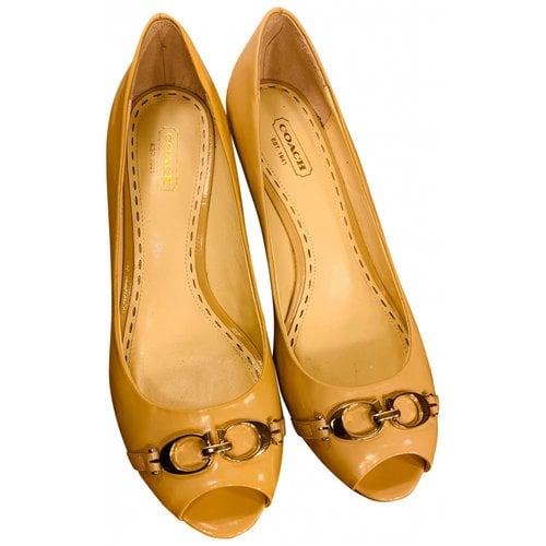 Pre-owned Coach Patent Leather Heels In Yellow