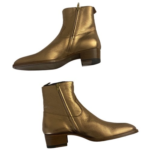 Pre-owned Saint Laurent Wyatt Leather Boots In Gold