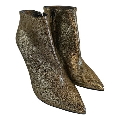 Pre-owned Alexander Mcqueen Leather Ankle Boots In Gold
