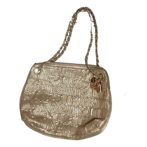 Pre-owned Moschino Cloth Handbag In Gold