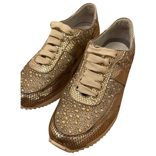 Pre-owned Swarovski Leather Trainers In Gold