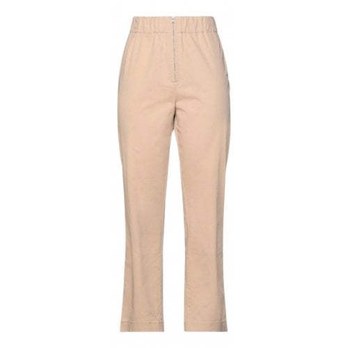 Pre-owned Ganni Trousers In Beige