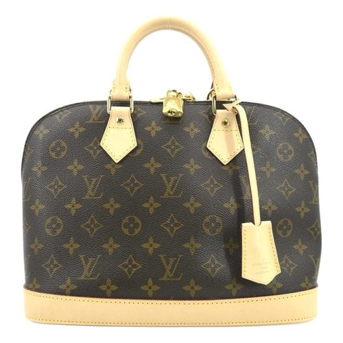 Pre-owned Louis Vuitton Alma Cloth Satchel In Brown