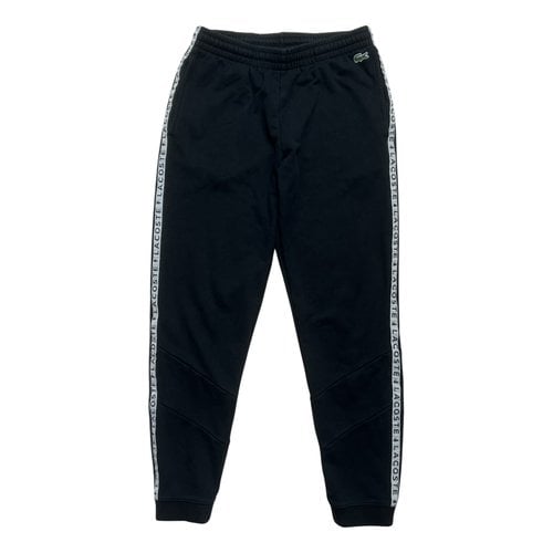 Pre-owned Lacoste Trousers In Black