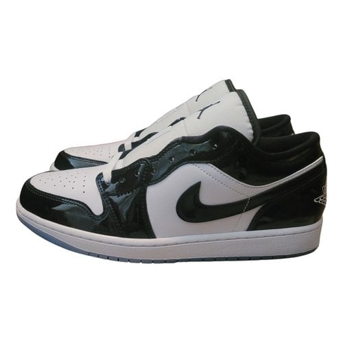 Pre-owned Jordan 1 Patent Leather Low Trainers In Black
