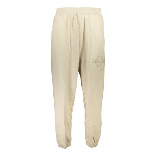 Pre-owned Calvin Klein Trousers In Beige