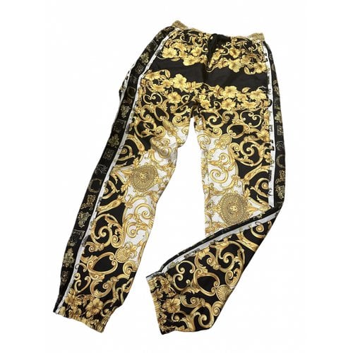 Pre-owned Versace Silk Trousers In Gold