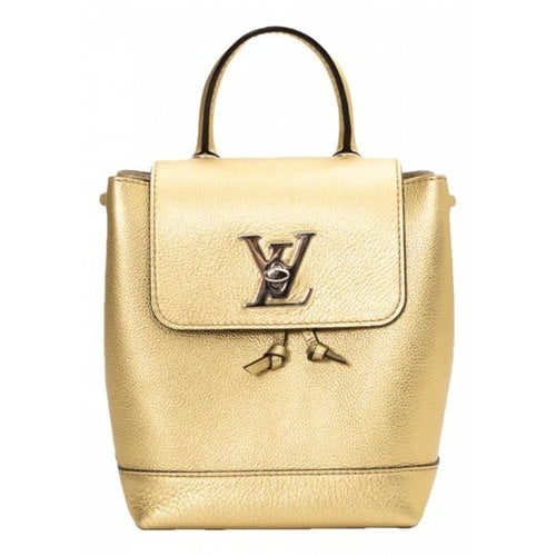Pre-owned Louis Vuitton Lockme Leather Backpack In Gold