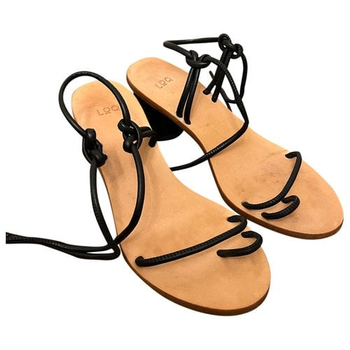Pre-owned Loq Leather Sandal In Black