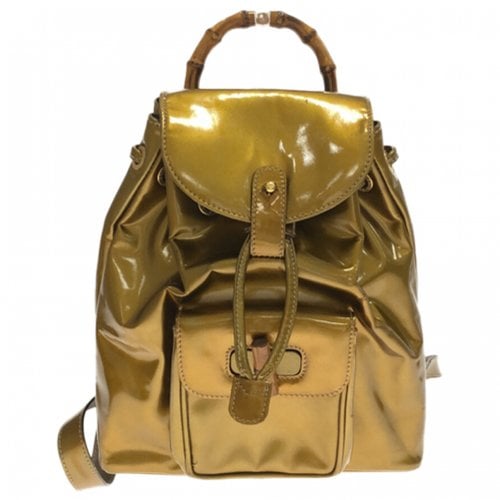 Pre-owned Gucci Bamboo Patent Leather Backpack In Gold
