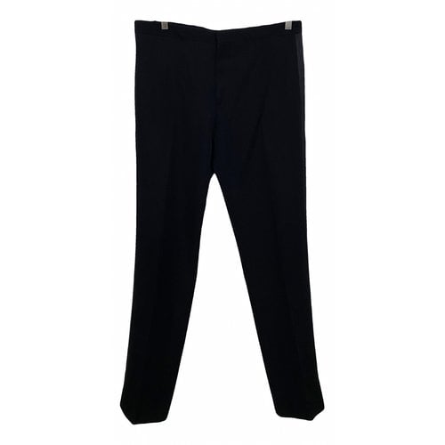 Pre-owned Saint Laurent Wool Trousers In Black