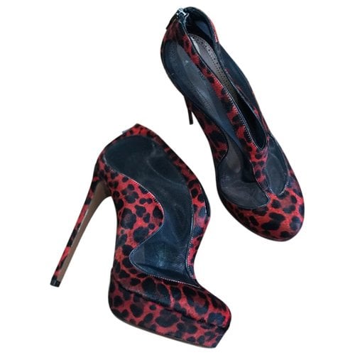 Pre-owned Alaïa Pony-style Calfskin Ankle Boots In Red