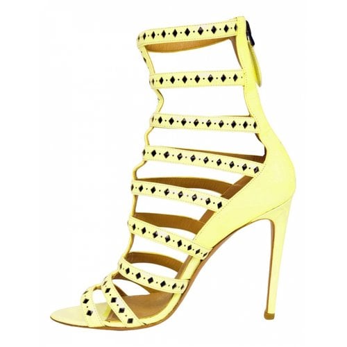 Pre-owned Alaïa Patent Leather Ankle Boots In Yellow
