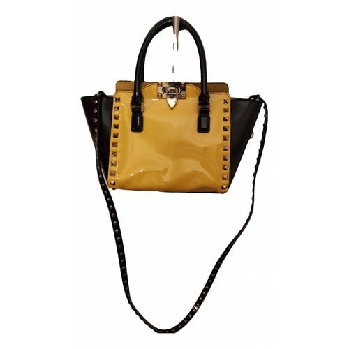 Pre-owned Valentino Garavani Rockstud Patent Leather Handbag In Yellow