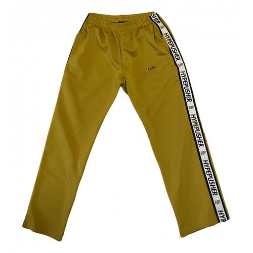 Pre-owned Omc Trousers In Yellow