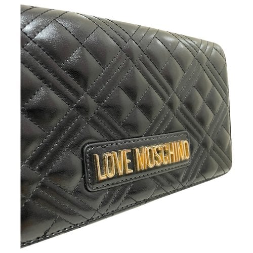 Pre-owned Moschino Love Leather Clutch Bag In Black