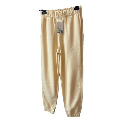 Pre-owned Ganni Trousers In Yellow