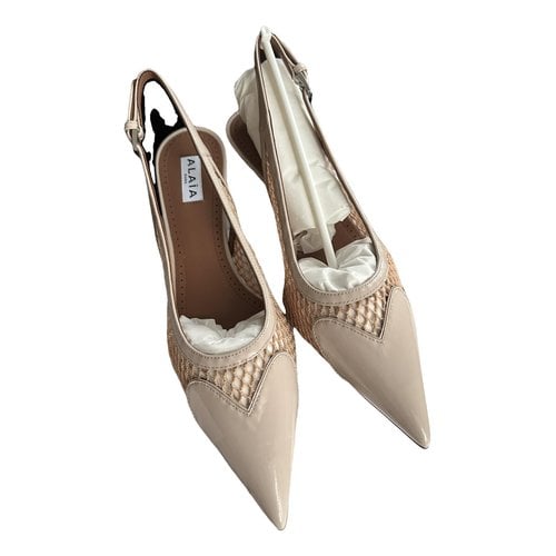 Pre-owned Alaïa Patent Leather Heels In Beige