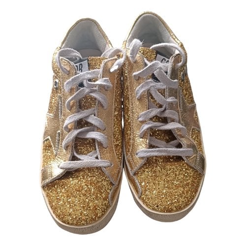 Pre-owned Golden Goose Superstar Glitter Trainers In Gold