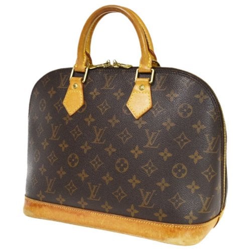 Pre-owned Louis Vuitton Alma Cloth Handbag In Brown