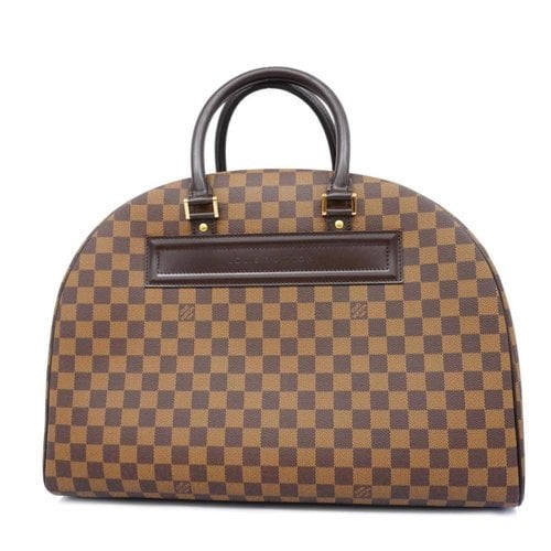 Pre-owned Louis Vuitton Nolita Cloth Handbag In Brown