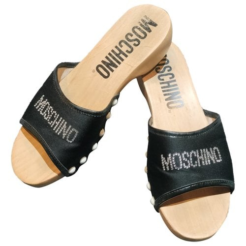 Pre-owned Moschino Cloth Mules & Clogs In Black