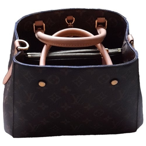 Pre-owned Louis Vuitton Montaigne Cloth Handbag In Brown