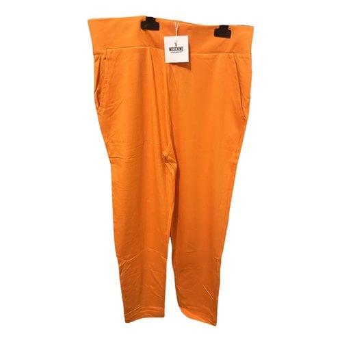 Pre-owned Moschino Trousers In Orange