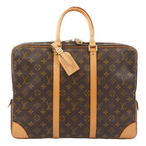 Pre-owned Louis Vuitton Porte Documents Voyage Cloth Handbag In Brown