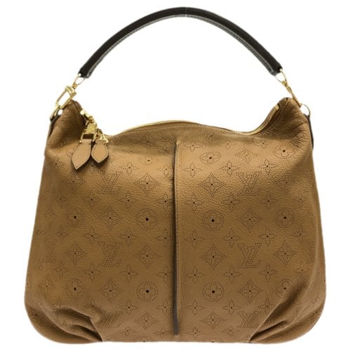 Pre-owned Louis Vuitton Madeleine Leather Handbag In Brown