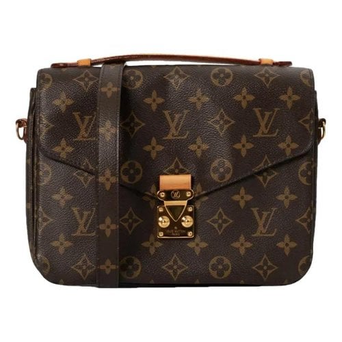 Pre-owned Louis Vuitton Metis Cloth Handbag In Brown