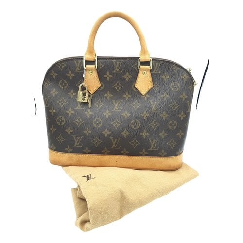 Pre-owned Louis Vuitton Alma Cloth Handbag In Brown