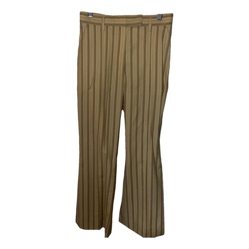Pre-owned Acne Studios Trousers In Gold