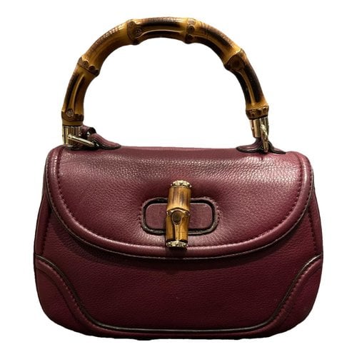 Pre-owned Gucci Convertible Pompon Bamboo Top Handle Leather Handbag In Burgundy