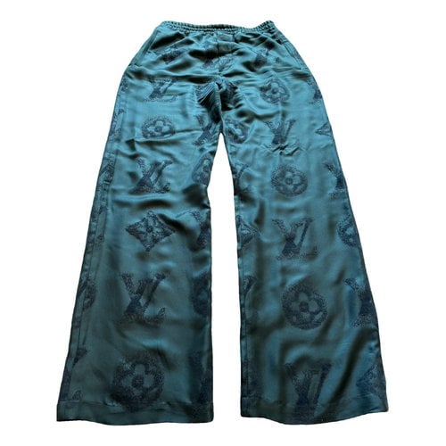 Pre-owned Louis Vuitton Silk Trousers In Green