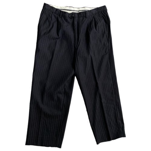 Pre-owned Dior Wool Trousers In Black