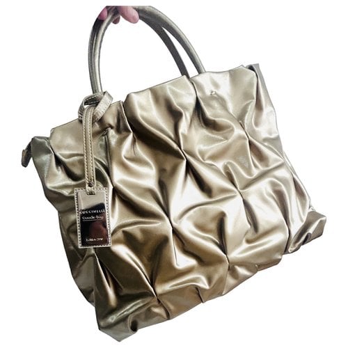 Pre-owned Coccinelle Handbag In Gold