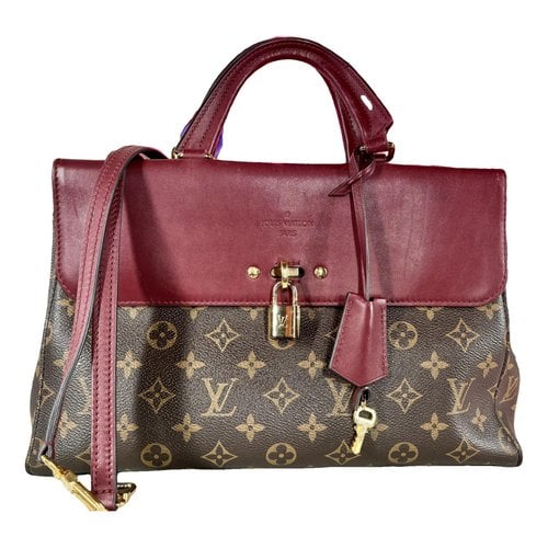 Pre-owned Louis Vuitton Vã©nus Leather Crossbody Bag In Brown