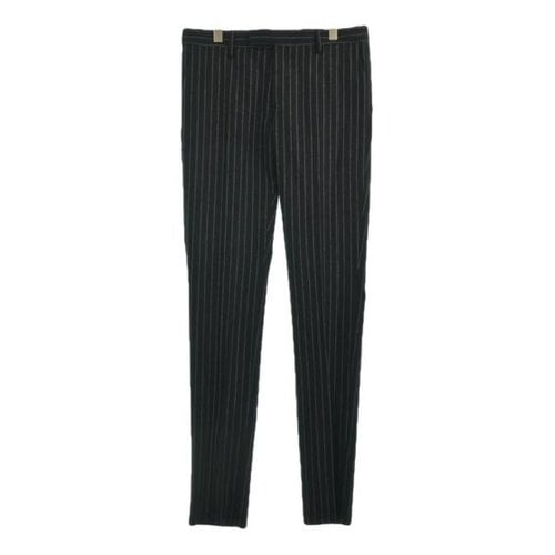 Pre-owned Saint Laurent Wool Trousers In Black