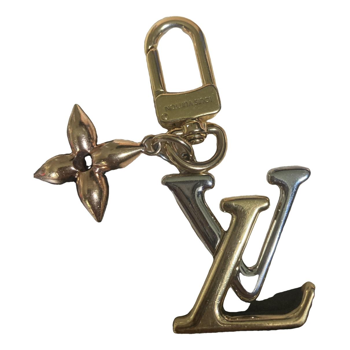 Louis Vuitton Silver and Gold Metal Twist Bag Charm Key Holder – EYE LUXURY  CONCIERGE