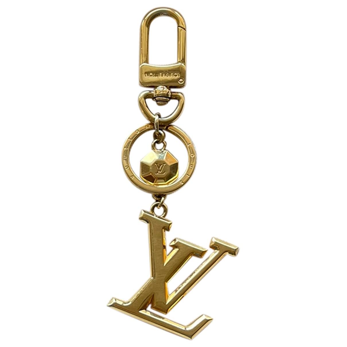 Bag charm Louis Vuitton Gold in gold and steel - 29811069