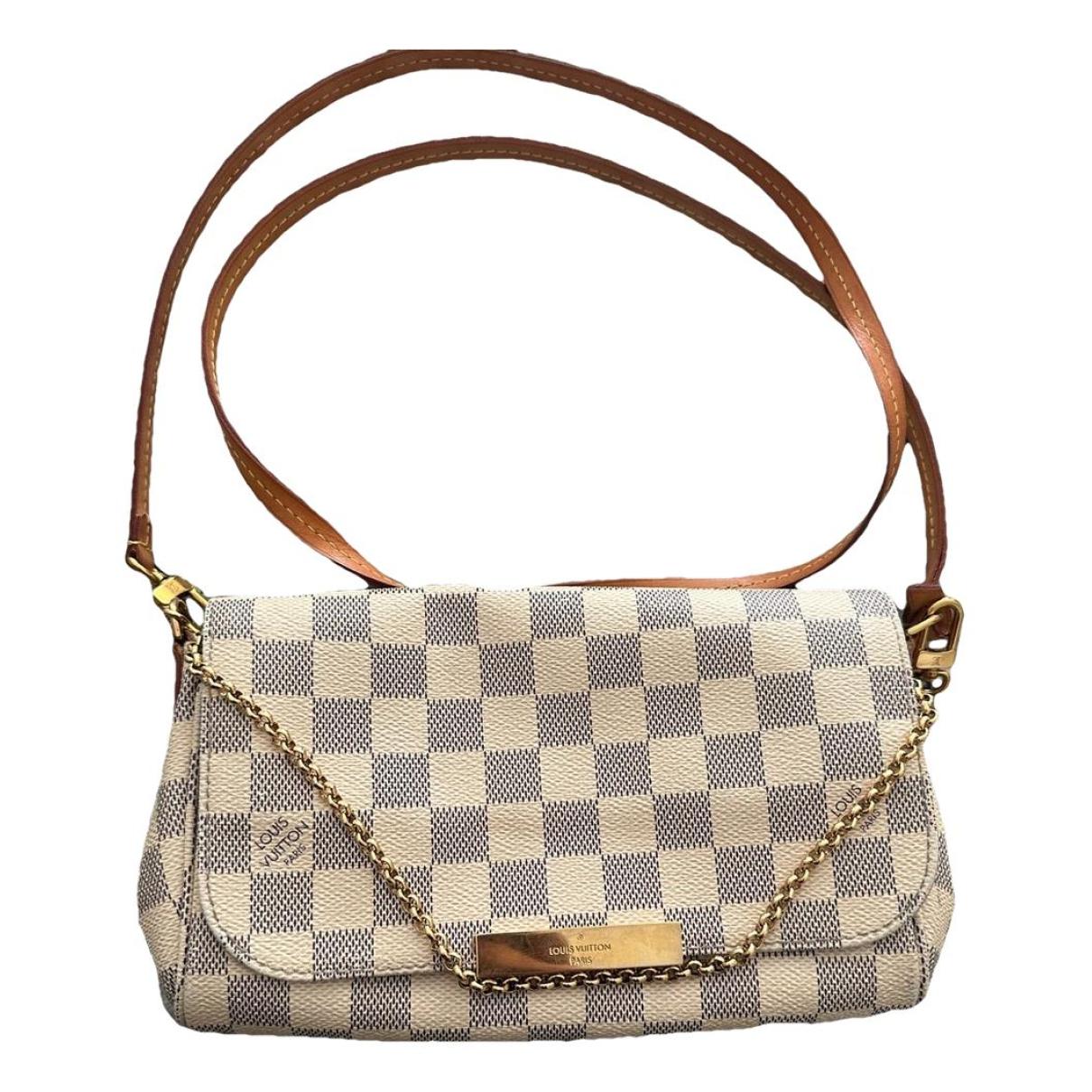 Pochette accessoire cloth handbag Louis Vuitton Brown in Cloth - 36097305