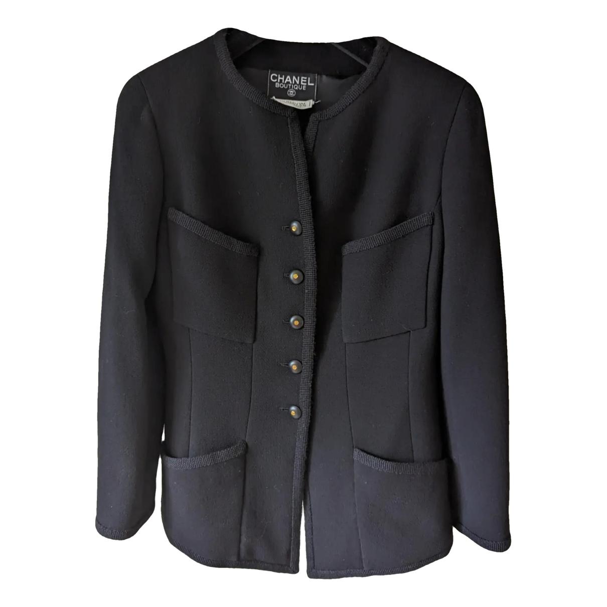 La petite veste noire tweed jacket Chanel Black size L International in  Tweed - 36581273