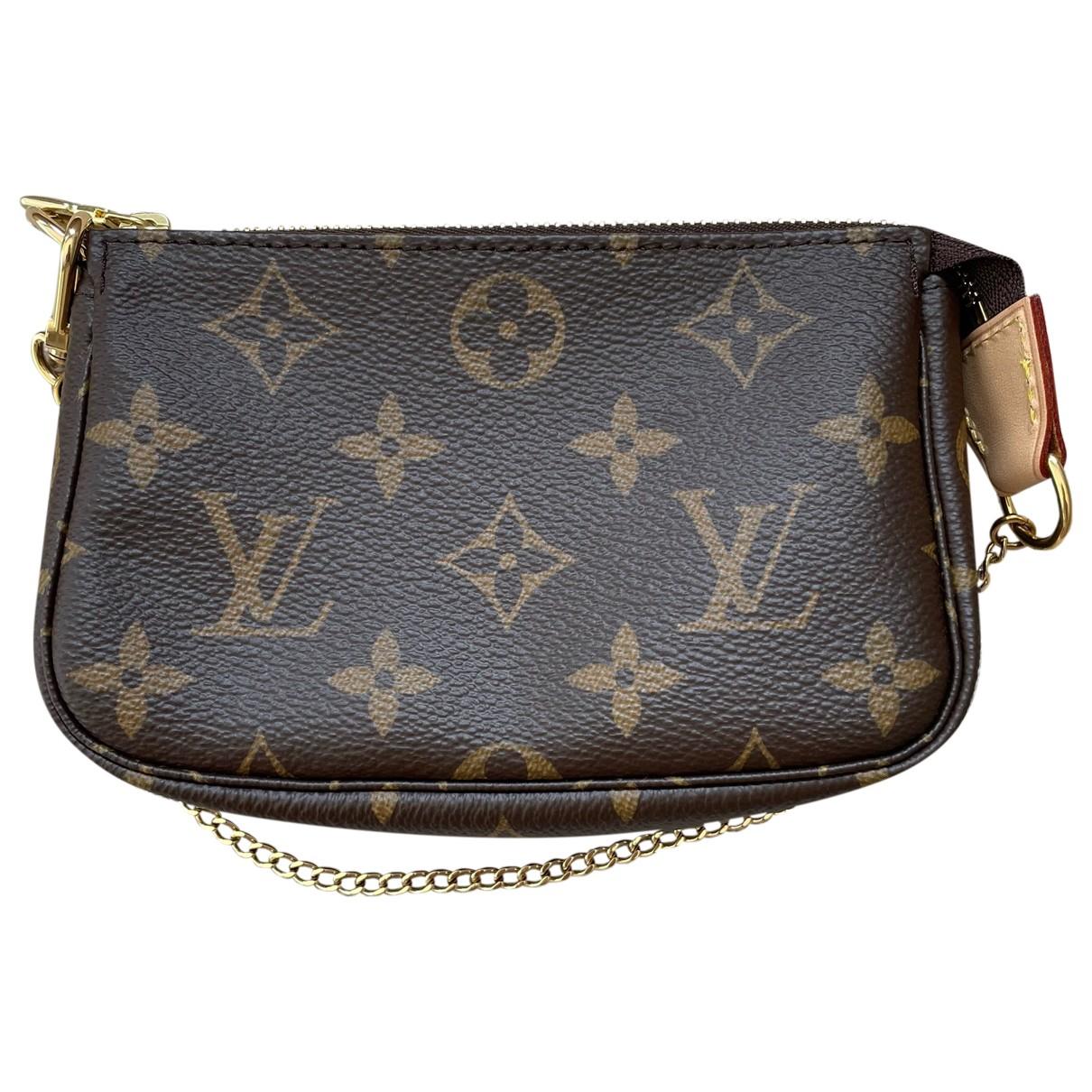 Pochette accessoire cloth handbag Louis Vuitton Brown in Fabric - 32551879