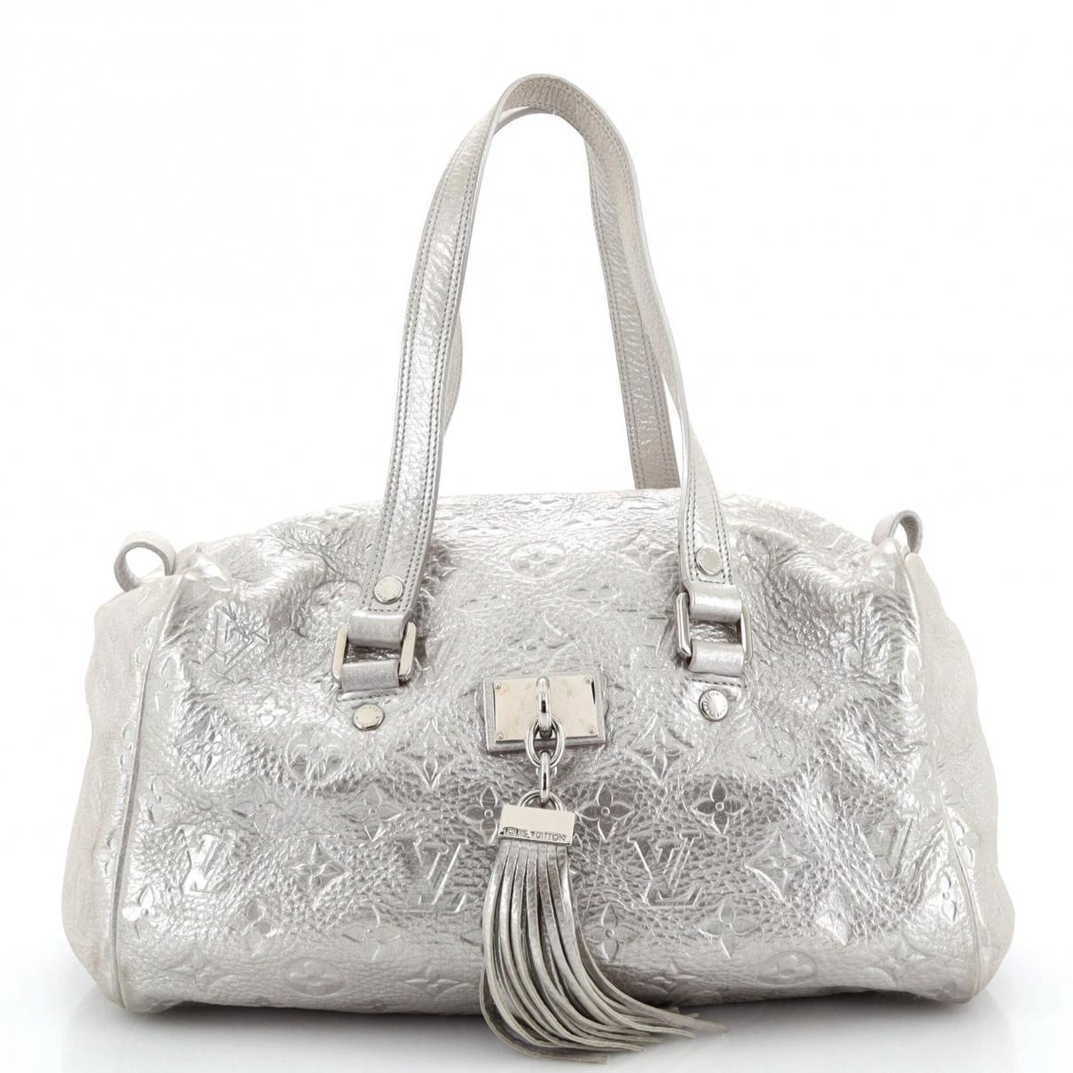 Louis Vuitton Swing Handbag Calfskin Leather Gold and Silver Color Fin –  EliteLaza