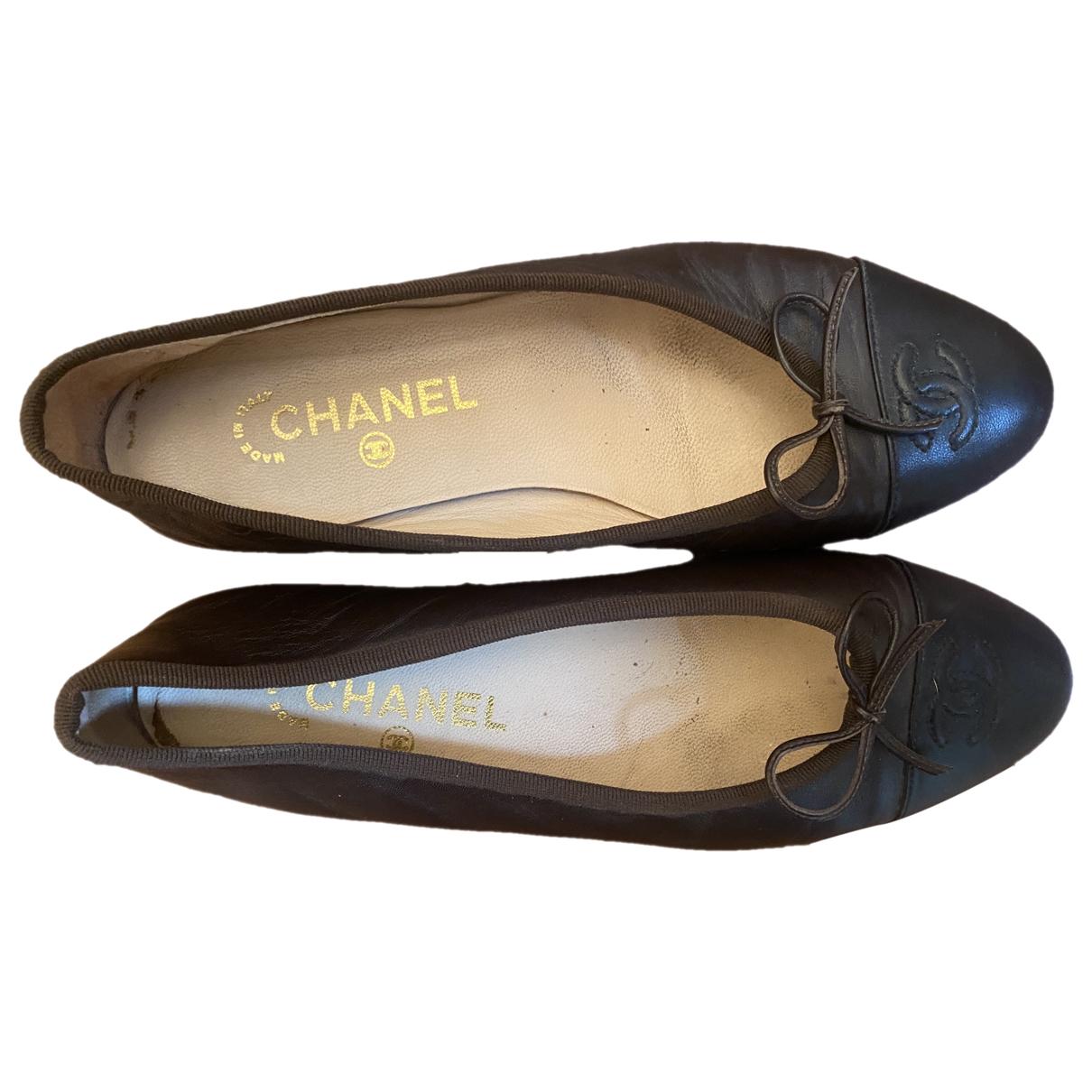 black leather chanel flats