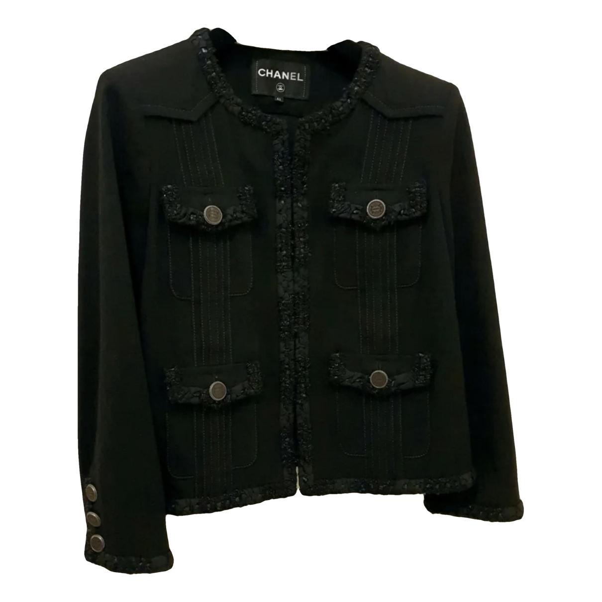 La petite veste noire tweed short vest Chanel Black size 36 FR in Tweed -  37439506
