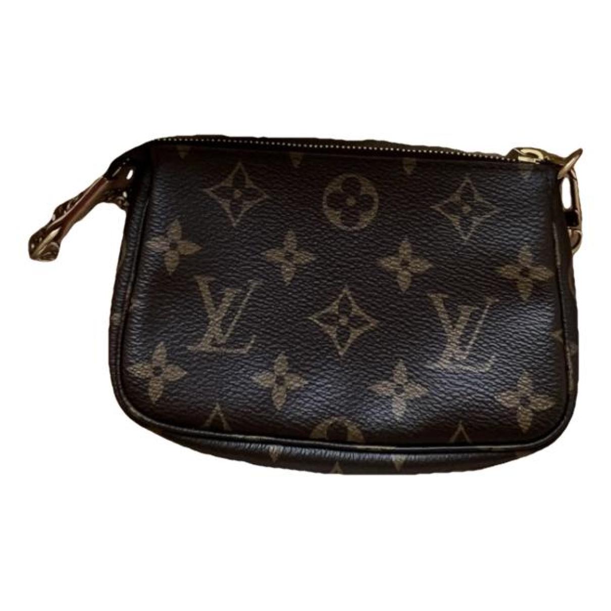 Pochette accessoire leather handbag Louis Vuitton Brown in Leather