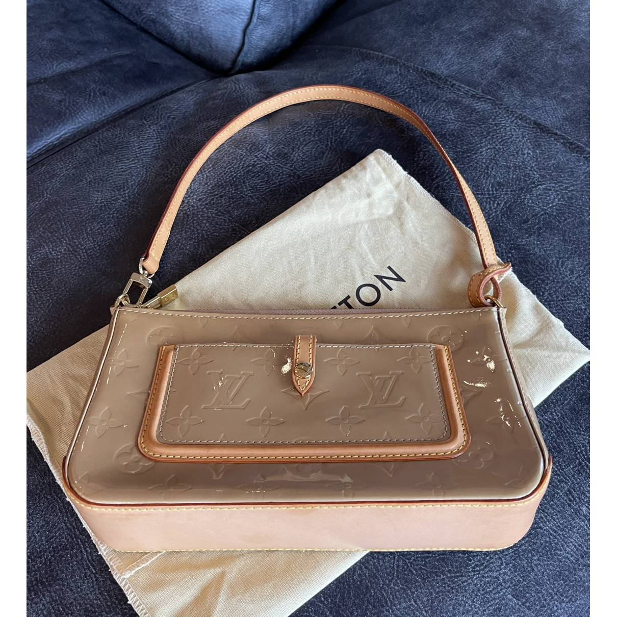 Pochette accessoire leather handbag Louis Vuitton Beige in Leather