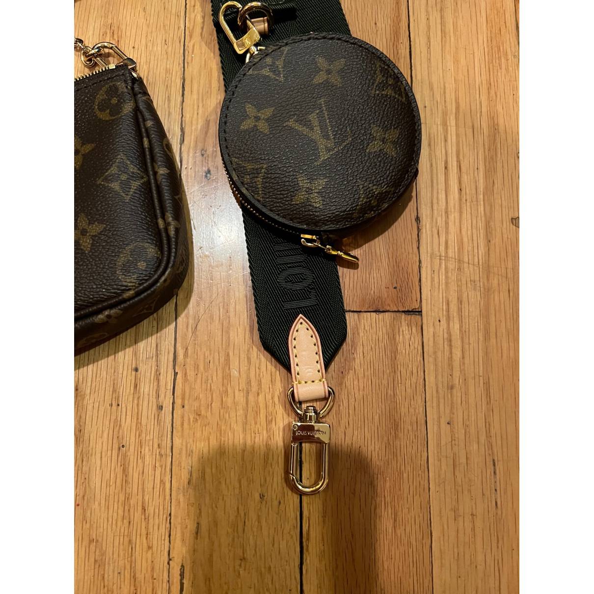Cloth handbag Louis Vuitton Brown in Cloth - 23187040
